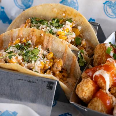 Chicken tacos and tater tots.