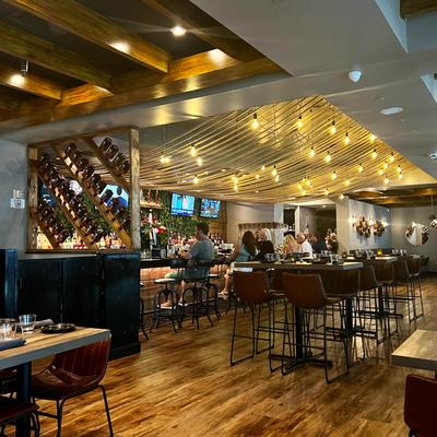Interior, tall tables and bar stools.