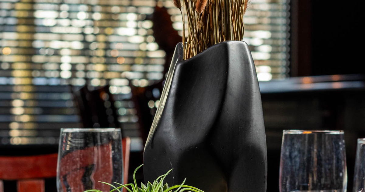 A close up of a table with table items and decoration