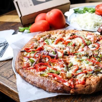 Cheese pizza with peppers and onions