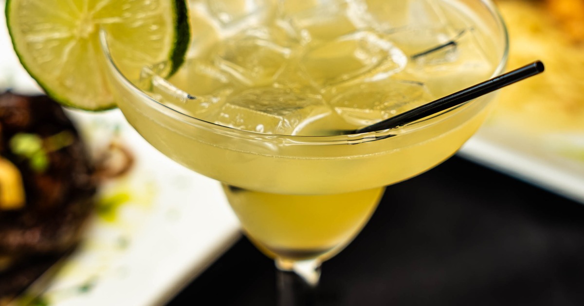 Margarita cocktail with a lime wheel garnish