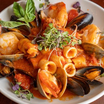 Jumbo shrimp, clams, mussels, and calamari plate, closeup.