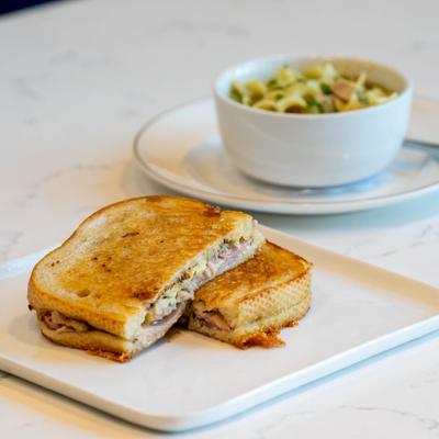 Bay of Pigs sandwich, with ham, pulled pork, gruyere, dill pickles, and mustard.