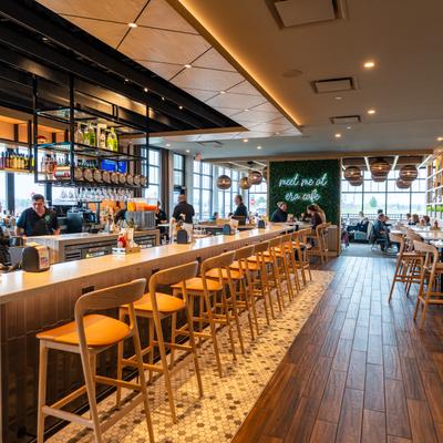 Bar, chairs, bartenders.