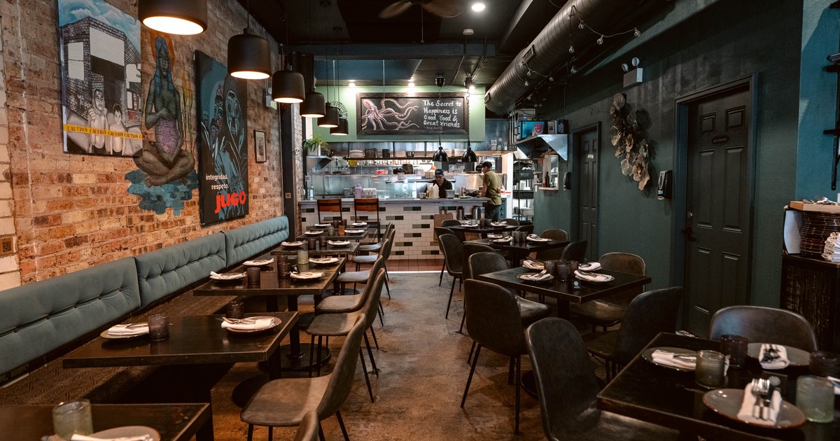 Interior view of a modern restaurant with brick walls