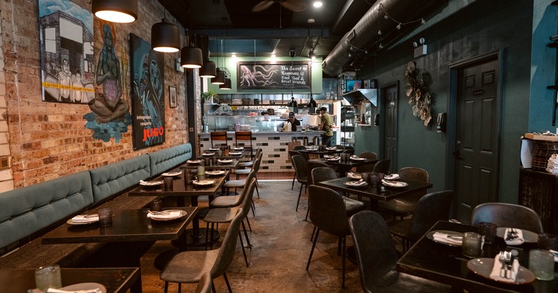 Interior view of a modern restaurant with brick walls