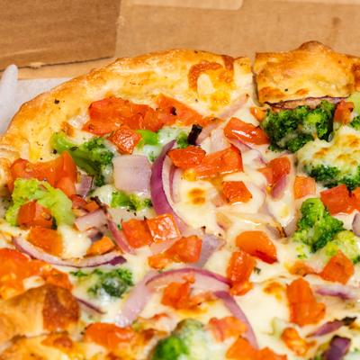 Close up shot of Veggie white garlic pizza.