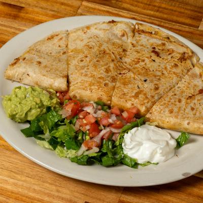 Quesadillas served with tomato salsa, guacamole, and sour cream.