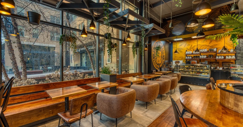 Interior, seating area with cozy sofas and wooden benches