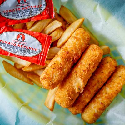 Mozzarella sticks with fries and ketchup, top view.