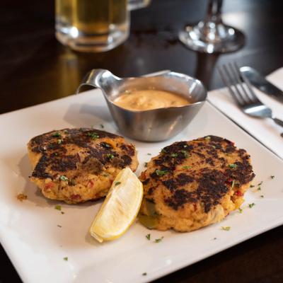 Crab cakes, served with sauce.