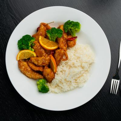 Orange chicken with steamed rice and broccoli.