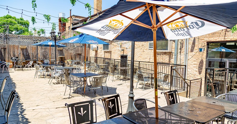 Exterior, patio, tables with parasols and chairs
