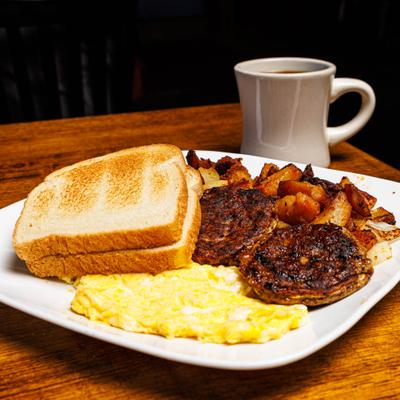 Turkey patties with scrambled eggs, potatoes, and toast.