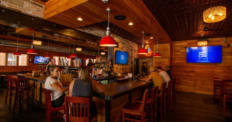 Customers sitting at the bar