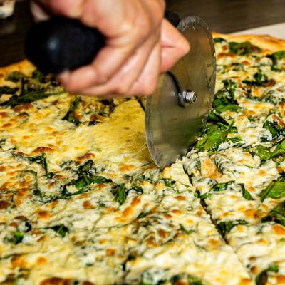 Aunt Roses Pizza, cutting.