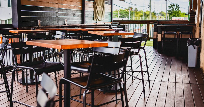 Covered seating area with tables and chairs