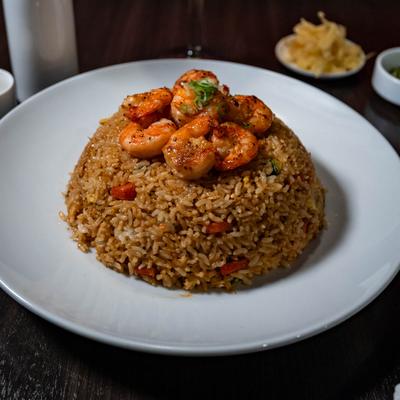 Fried rice topped with shrimps.