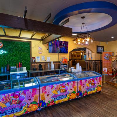 Ice cream parlor with multiple freezers.