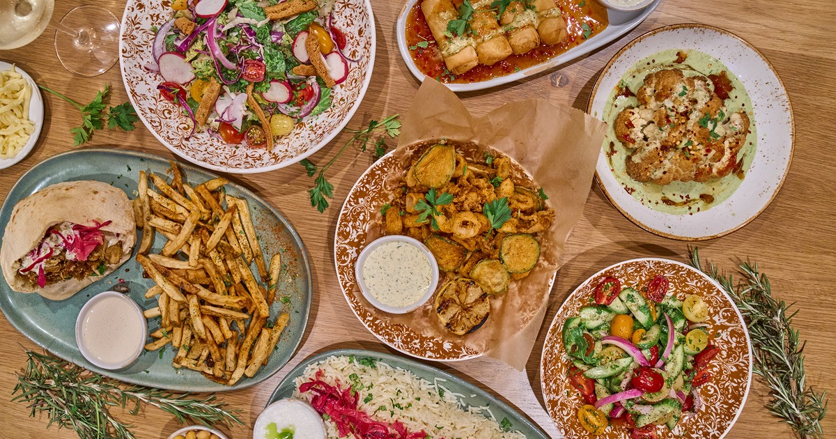An assortment of food plates, overhead view