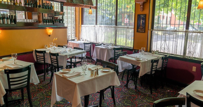 Interior, tables in dining are prepared for customers