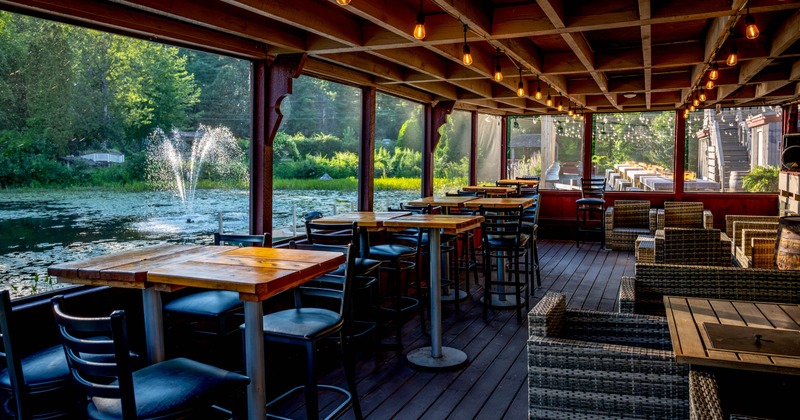 Exterior, tables and chairs near the lake, ready for guests