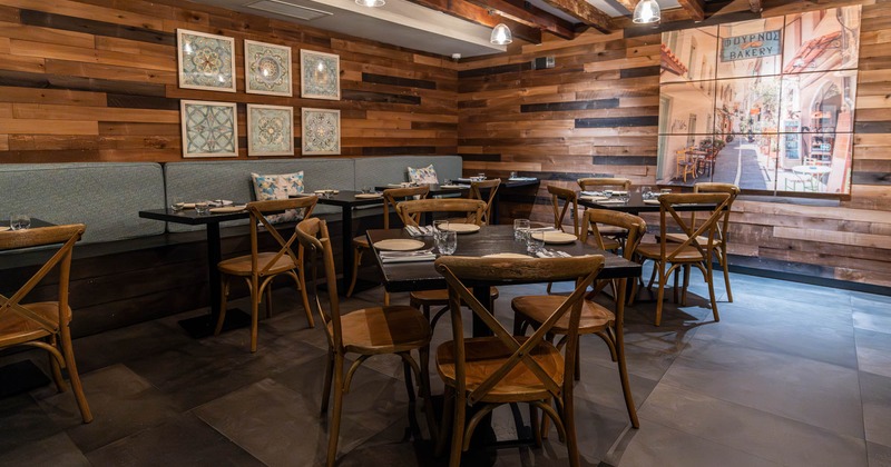 Dining area, tables ready for customers, wall decoration