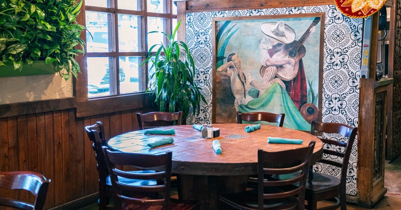 Interior, tables and chairs near window