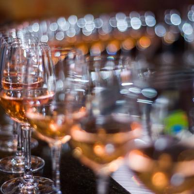 Close up of lined up glasses filled with a drink