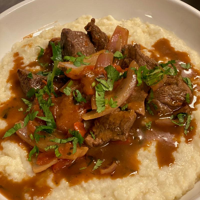 Lomo Saltado with Grits photo