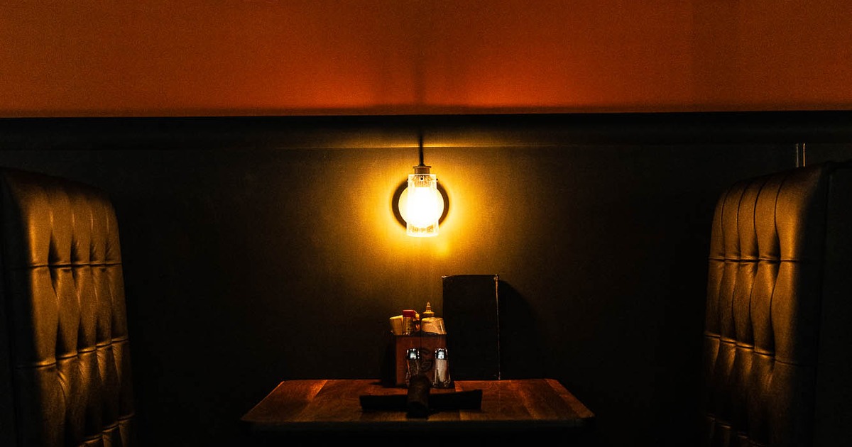 Interior, restaurant booth with lamp on the wall