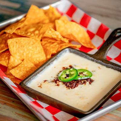 Queso dip with chorizo and jalapenos, close up