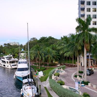 Ships docked by the park coast.