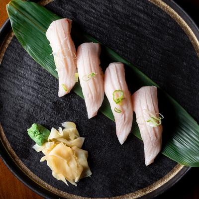 Yellowtail nigiri sushi, top view.