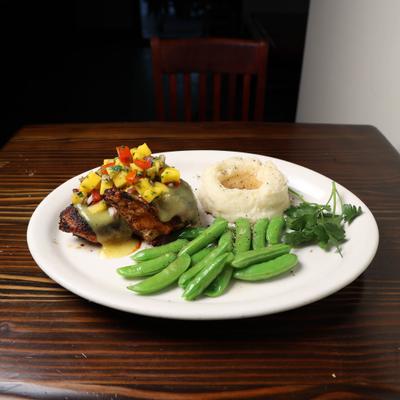 Jerk Chicken and snap peas and mashed potatoes gravy.