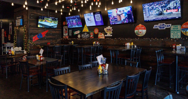 Interior seating area with wooden tables and chairs