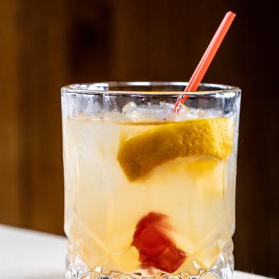 A glass of Old Fashioned.