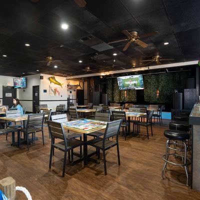 Diner area with tables and tv's.