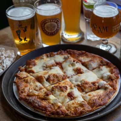 Cheese pizza with beers.
