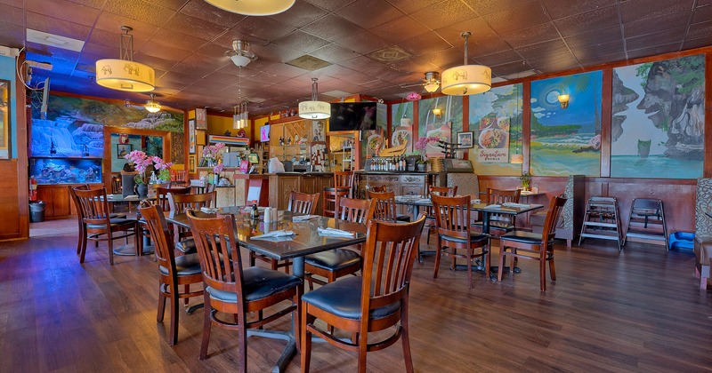 Interior, tables ready for guests, wall art