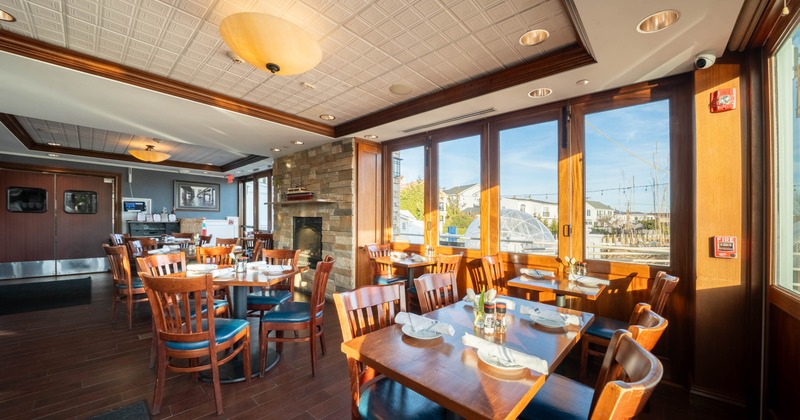 Interior, dining area, tables with chairs, warm atmosphere, built-in fireplace