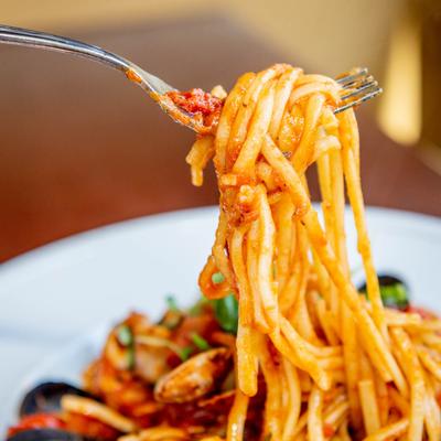Frutti Di Mare plate, spaghetti on a fork, close up