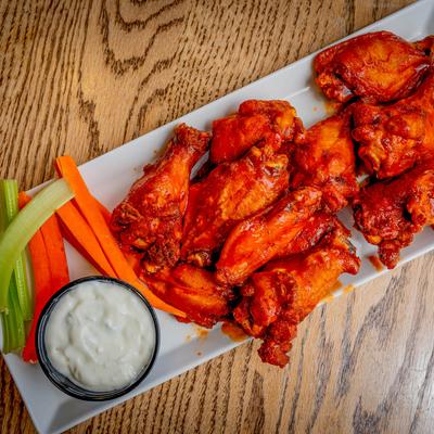 Bone in wings served with ranch, celery, and carrot sticks.