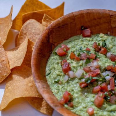 Guacamole and chips, top view.