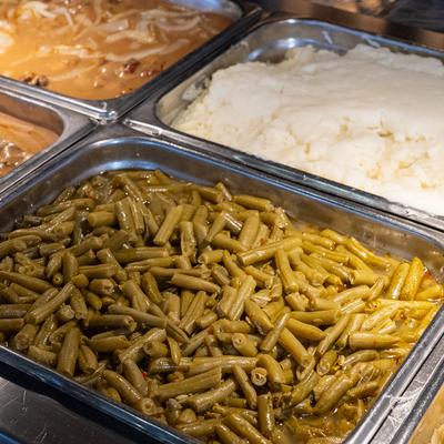 Various foods in serving containers.