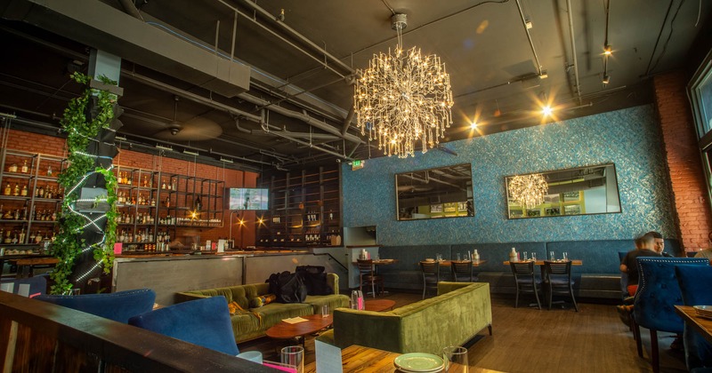 Interior, dining and lounge area, tables with chairs, sofas with coffee tables