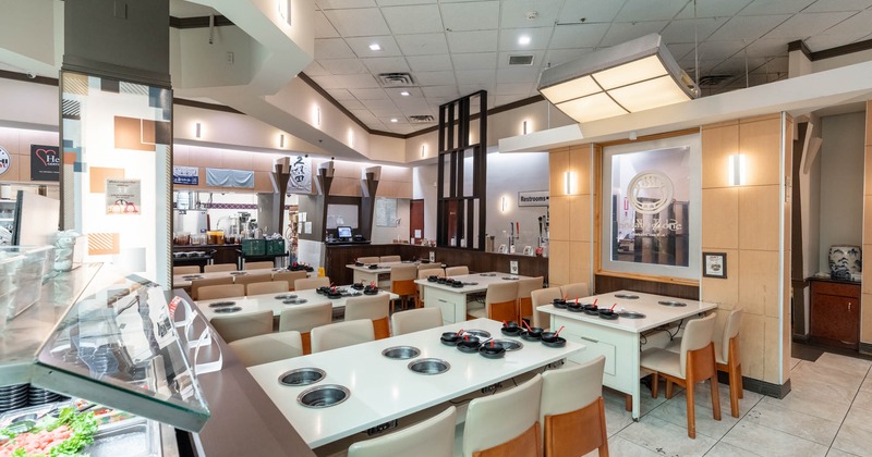 Interior, wide view, tables and chairs ready for guests