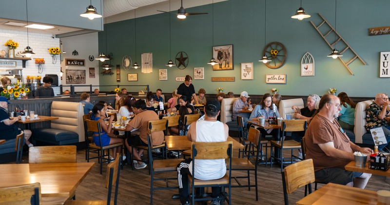 Diner and bar area, full of people