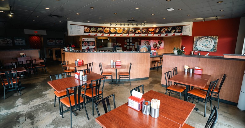 Interior, tables and chairs in dining area