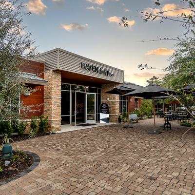 Exterior, angle view to entrance of restaurant with part of the access path.